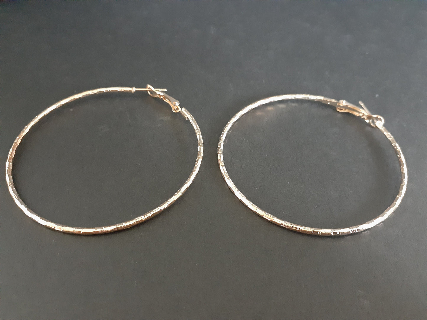 Cute Gold Coloured Twisted Hoop