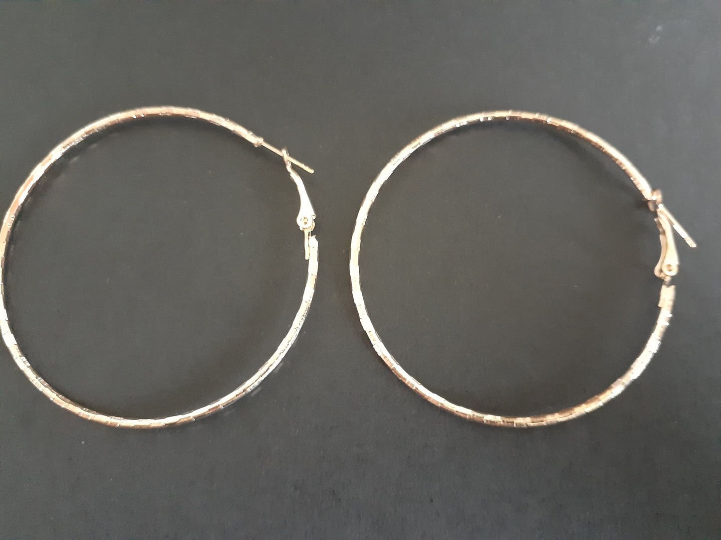Cute Gold Coloured Twisted Hoop